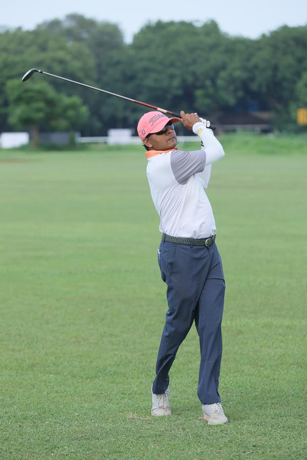 Golfer admiring the shot